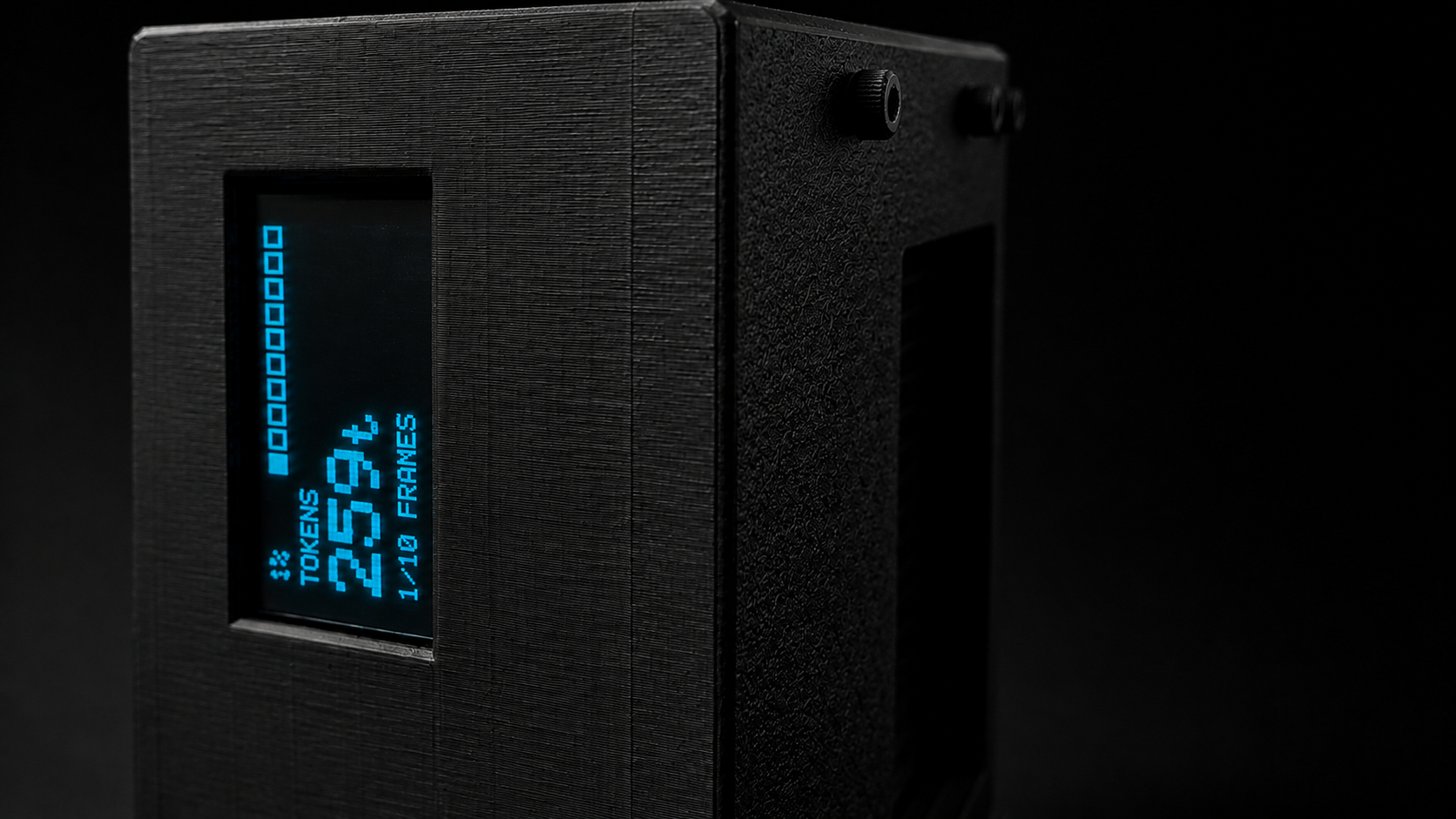 Macro de la pantalla OLED lateral mostrando tokens y frames